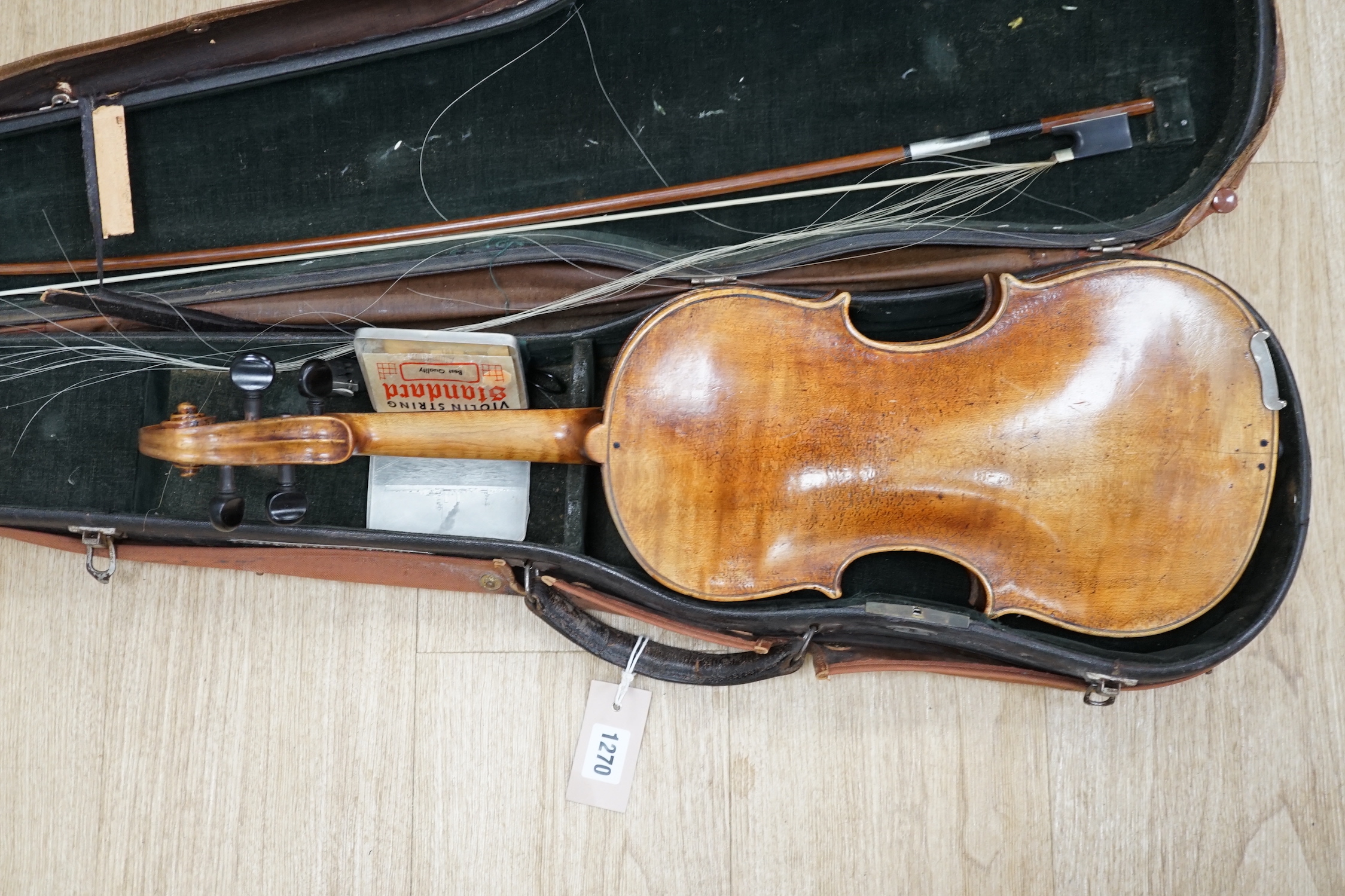 A cased 19th century German violin with paper label for Schweitzer copy Amati Pestini, length of body, 36cm, with bow CITES Submission reference 97BD7MYU